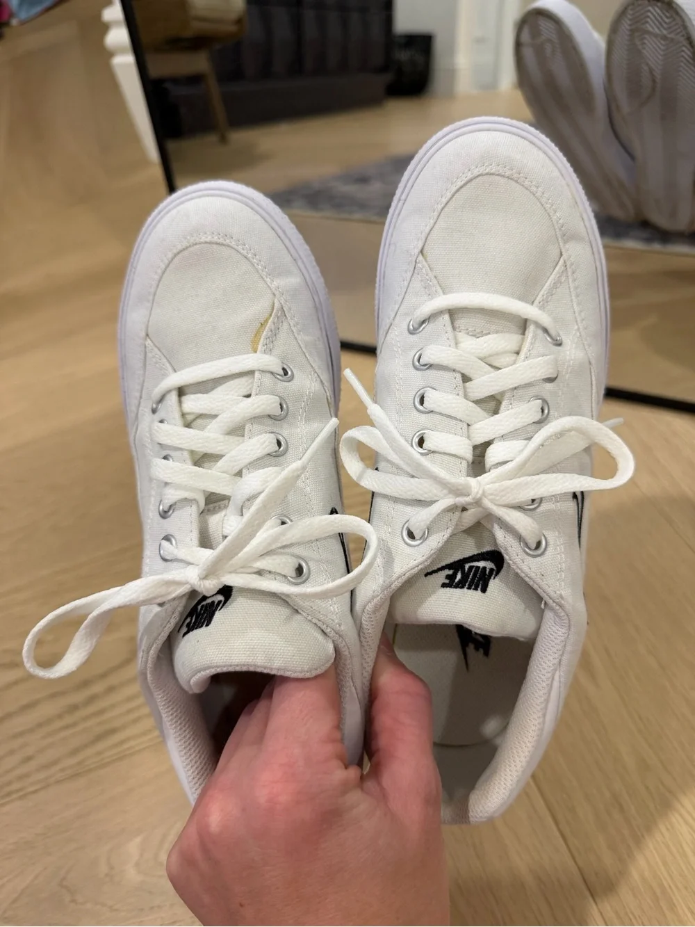 Nike Women’s White Canvas Sneakers with Black Swoosh